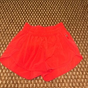 Lululemon High Waisted Shorts 3”. Orange color